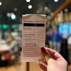 Ticket de livraison Uber Eats pour une pizza prestigieuse commandée chez Basilic & Co à Cambrai.